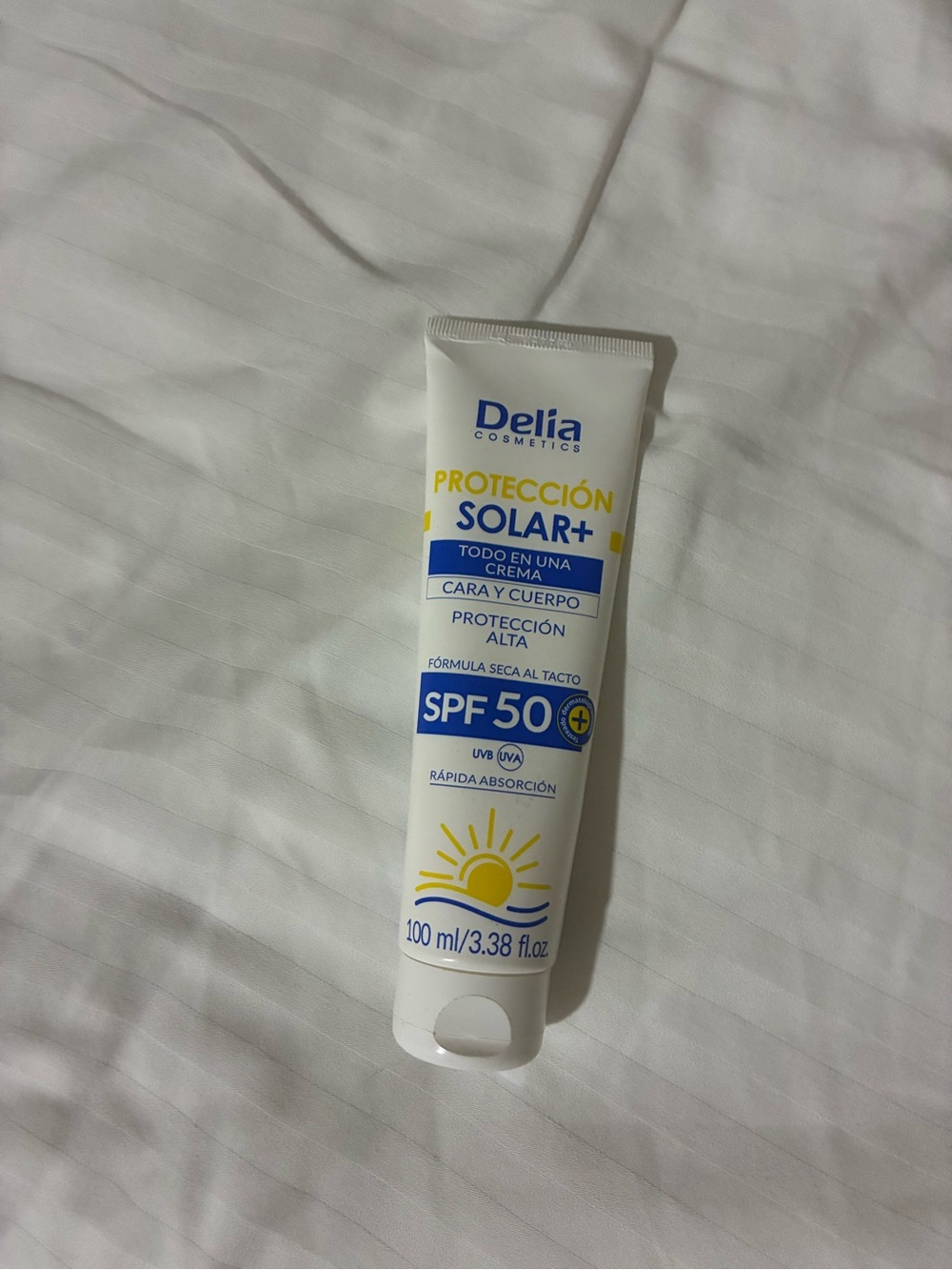 SPF 50 Sunscreen Tube in White and Yellow